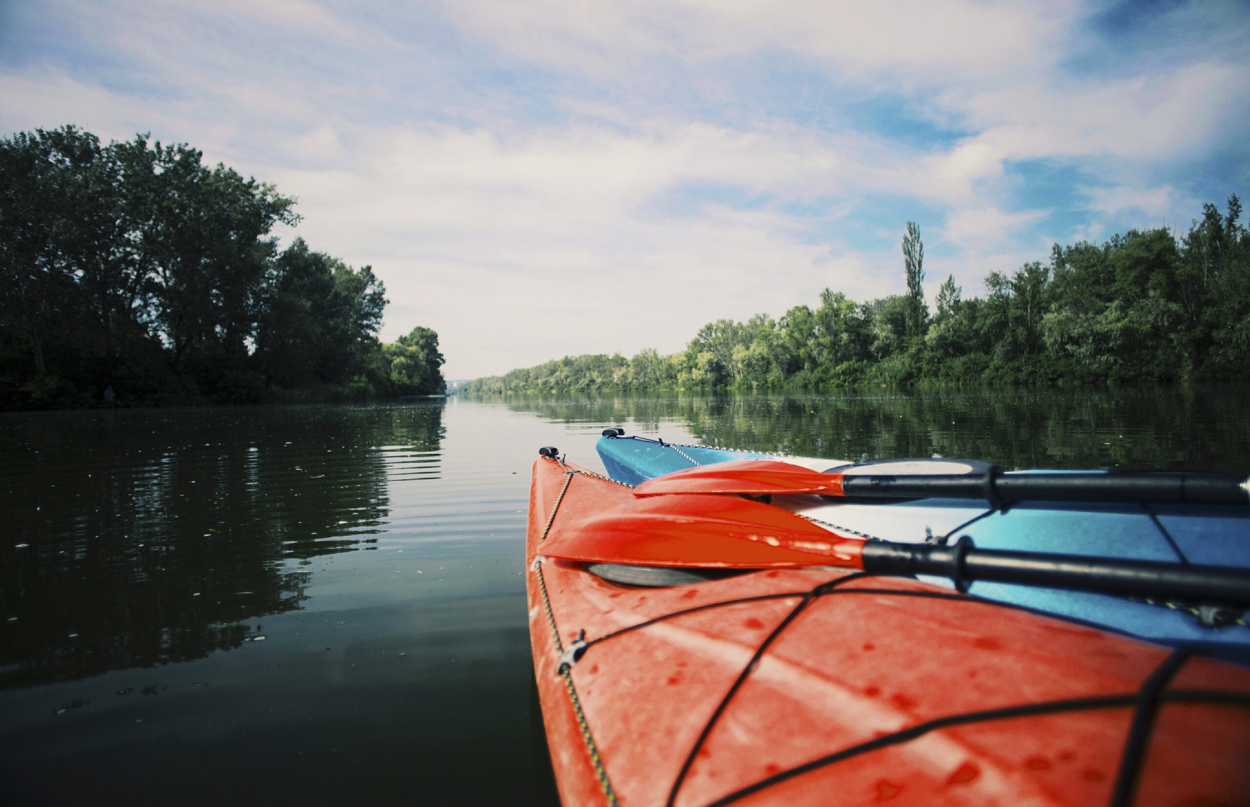 a-couple-of-kayaks-with-paddles