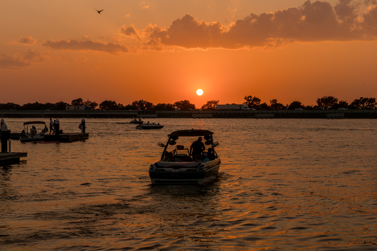 a lake in Texas featuring boats and a sunset view