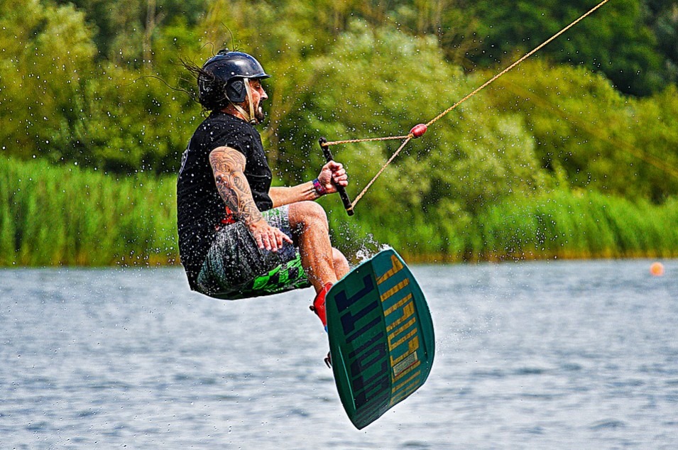 A man on a wakeboard jump