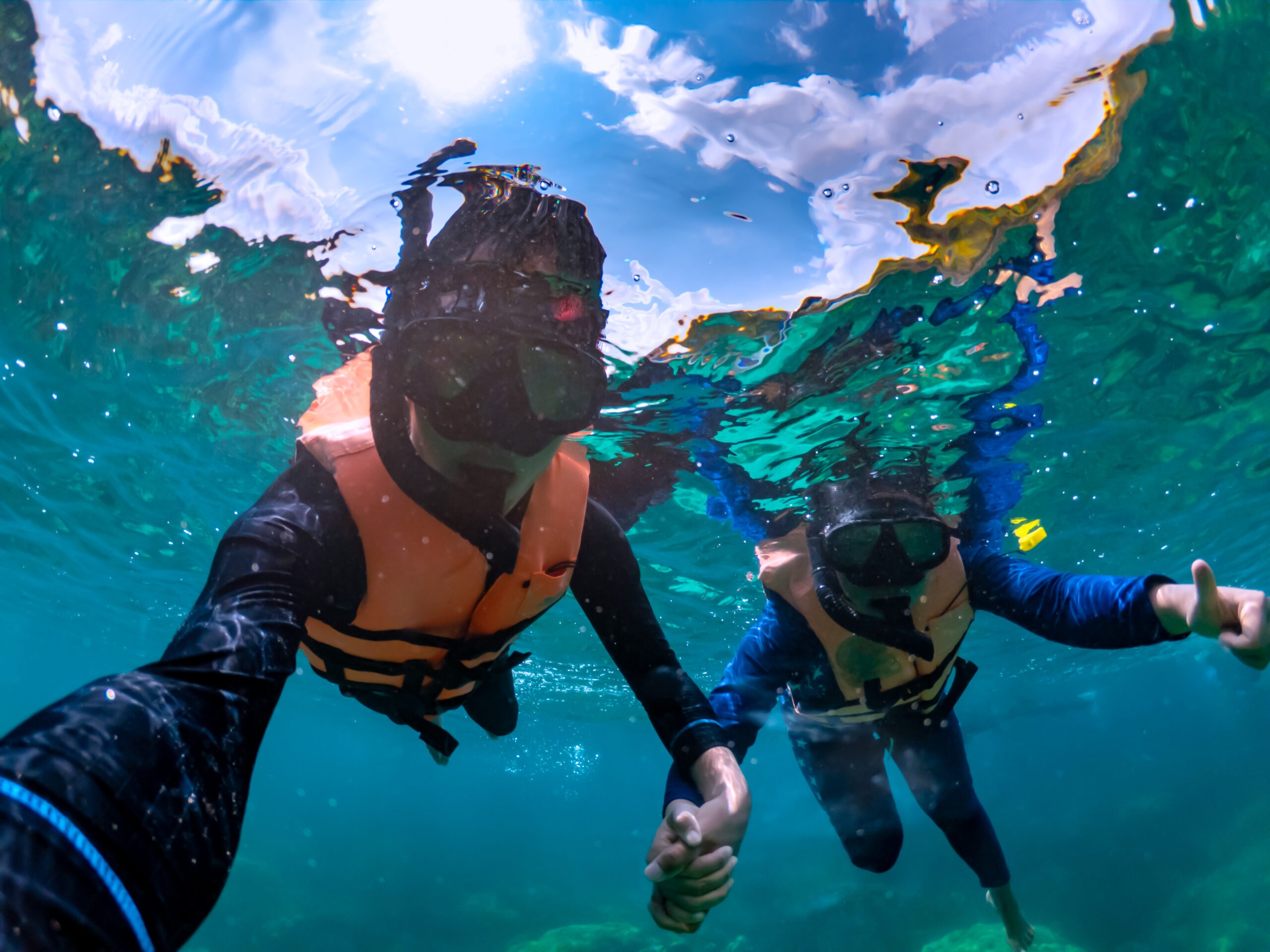 a-couple-snorkeling-under-tropical-sea