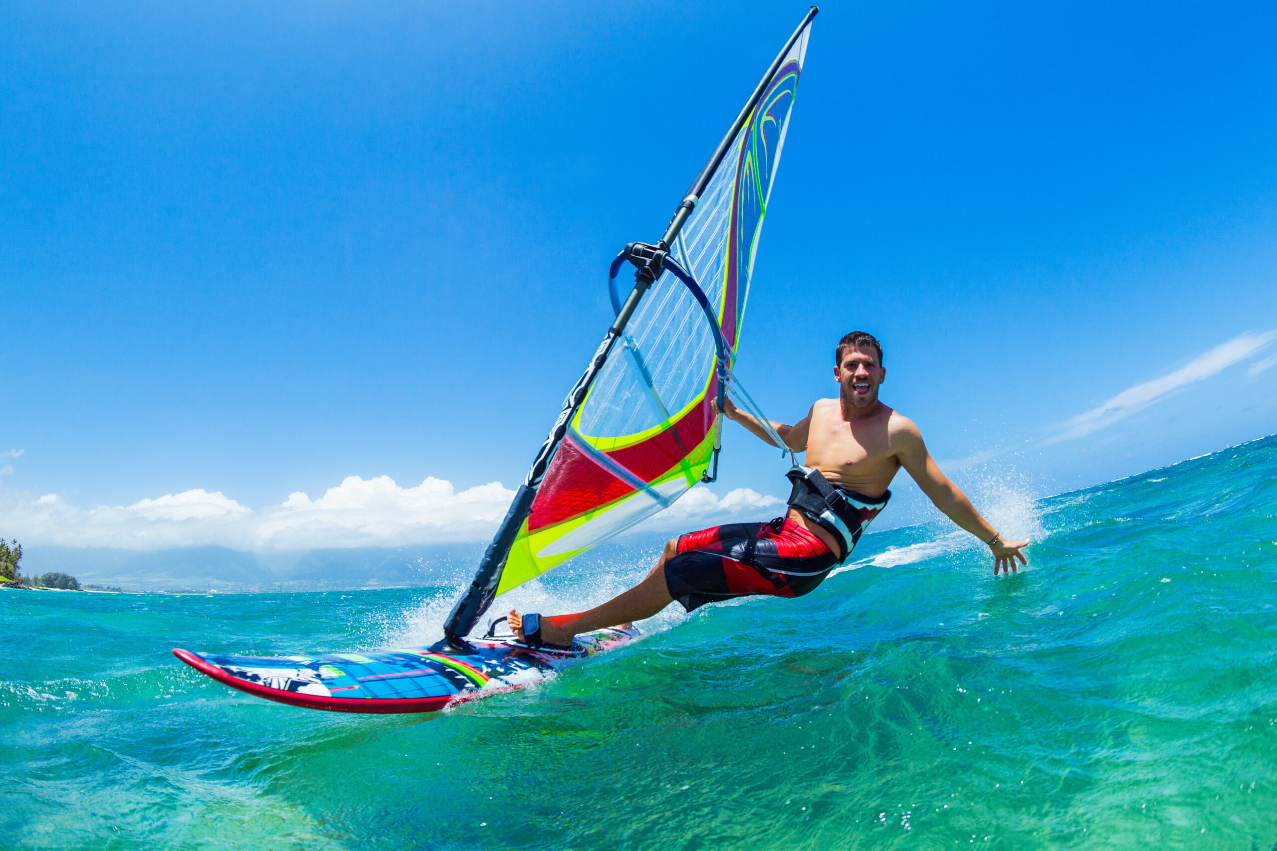 a-man-happily-windsurfing