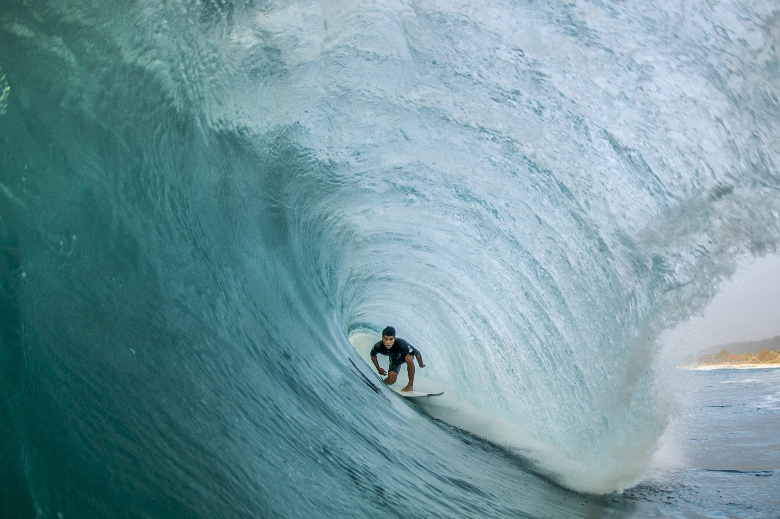 a-man-surfing-in-the-tunnel-of-a-wave