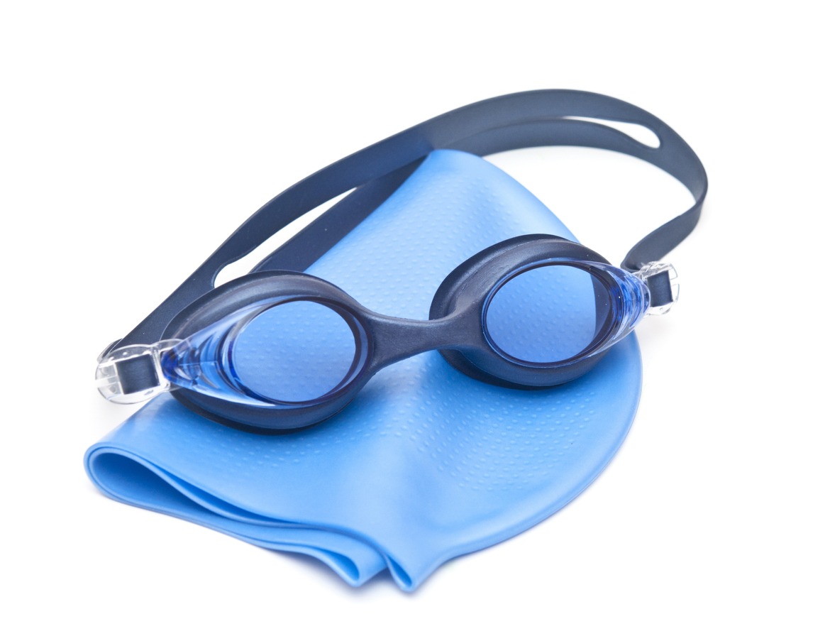 blue swimming cap and goggles