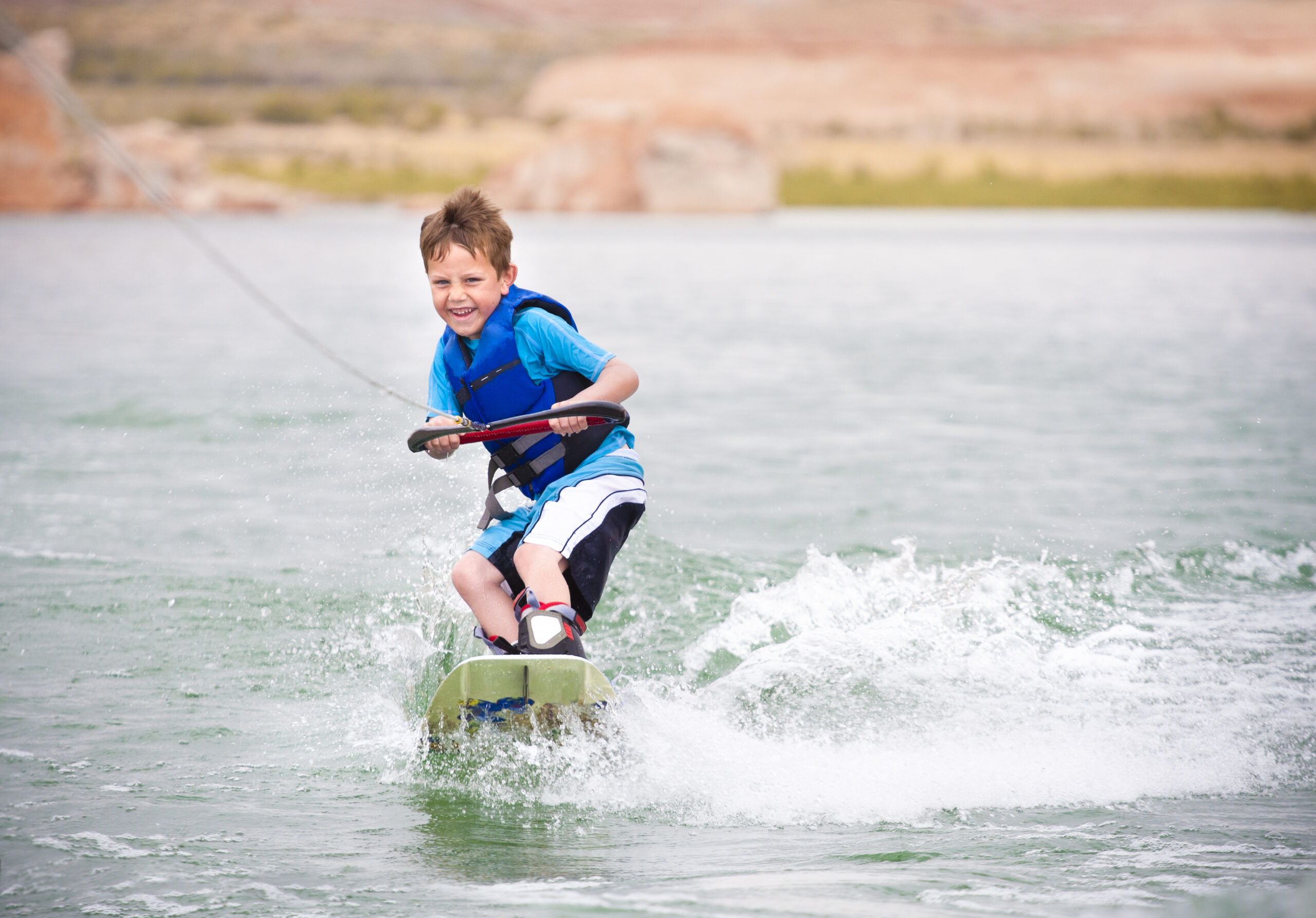 child-learning-to-wakeboard