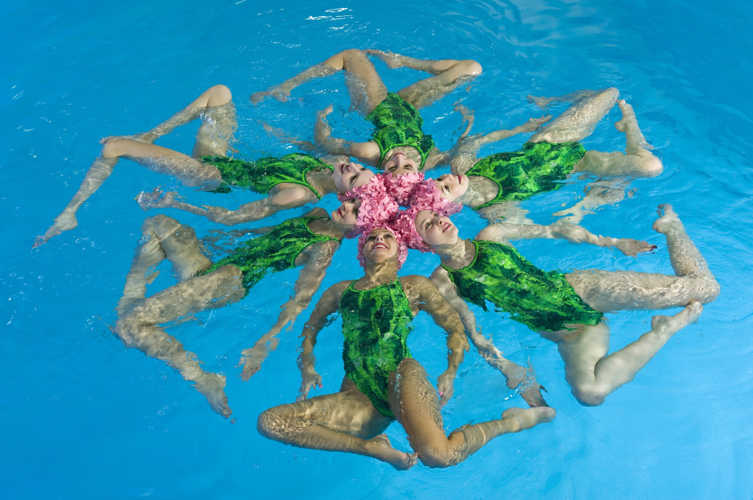 synchronized-swimmers-forming-a-floating-flower