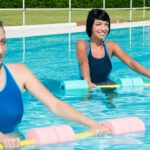 two-women-aquajogging-on-the-pool