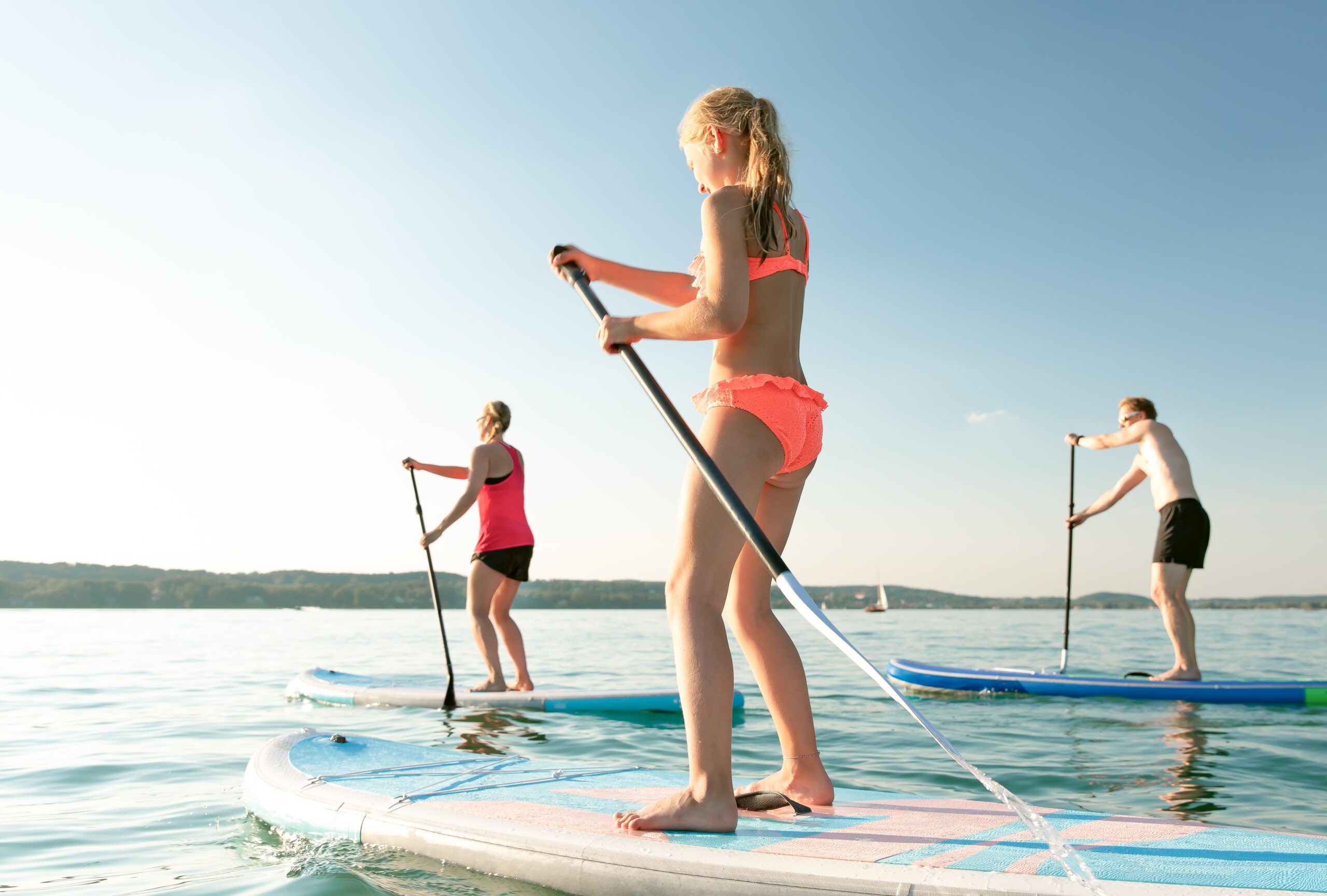 a-group-of-women-paddleboarding