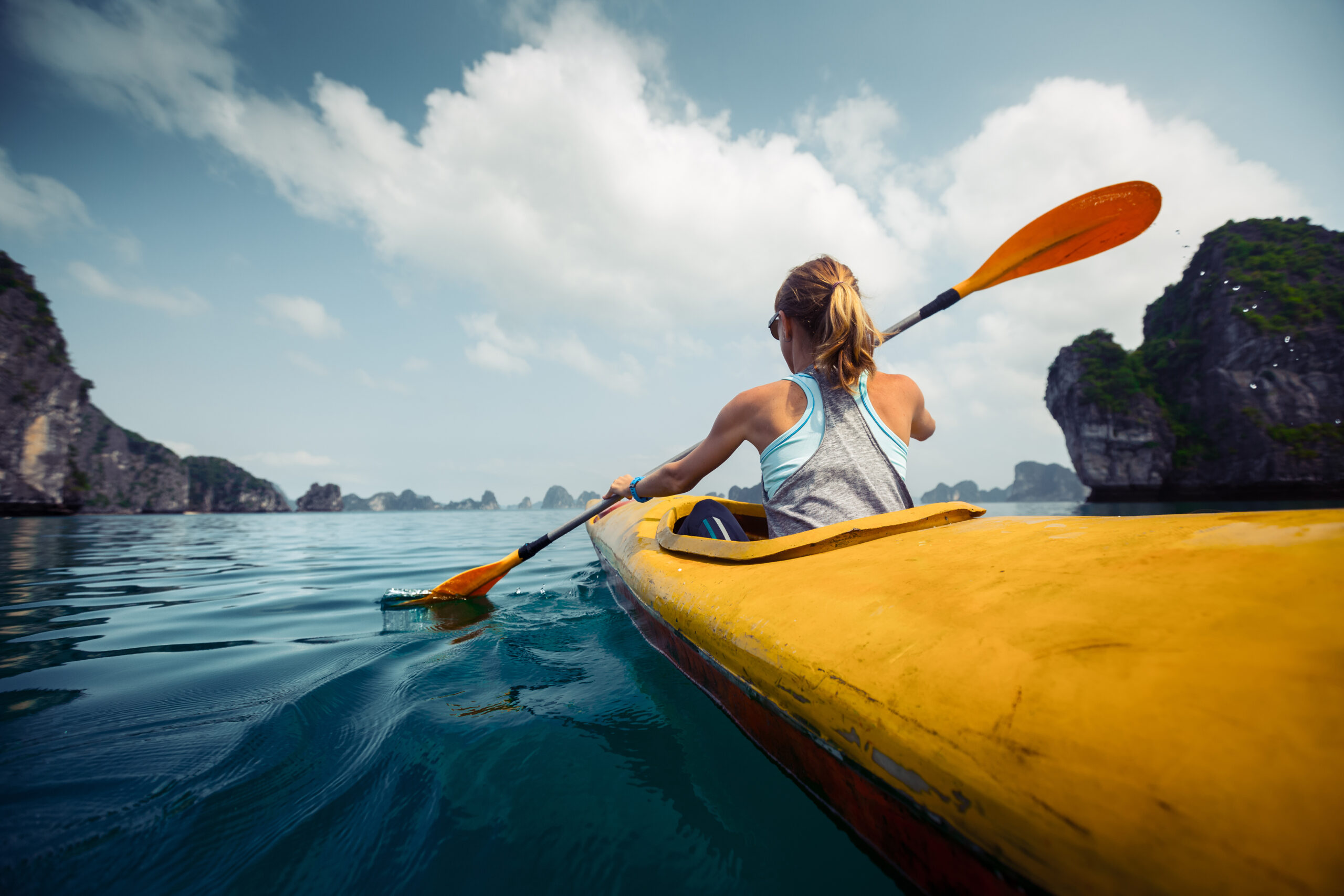 a-woman-doing-a-forward-stroke-on-a-kayak