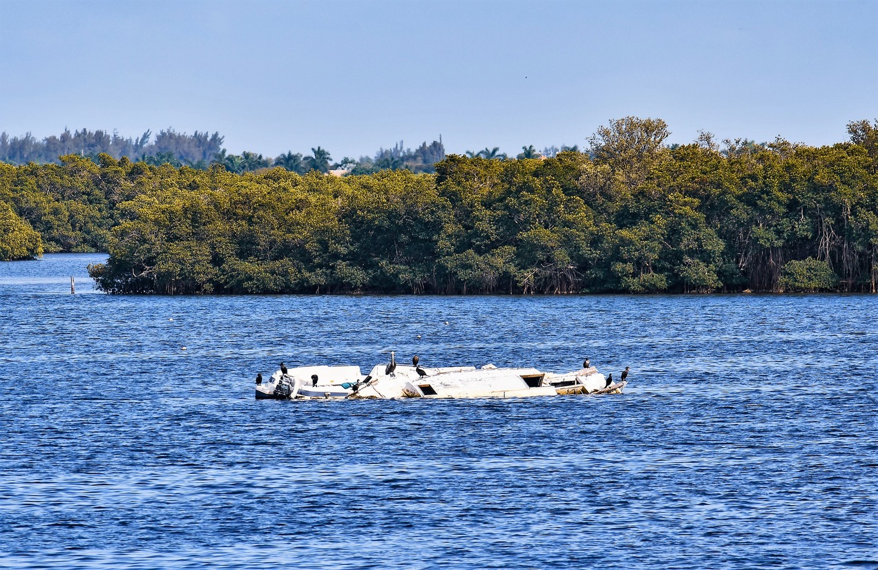 abandoned-capsized-sailboat