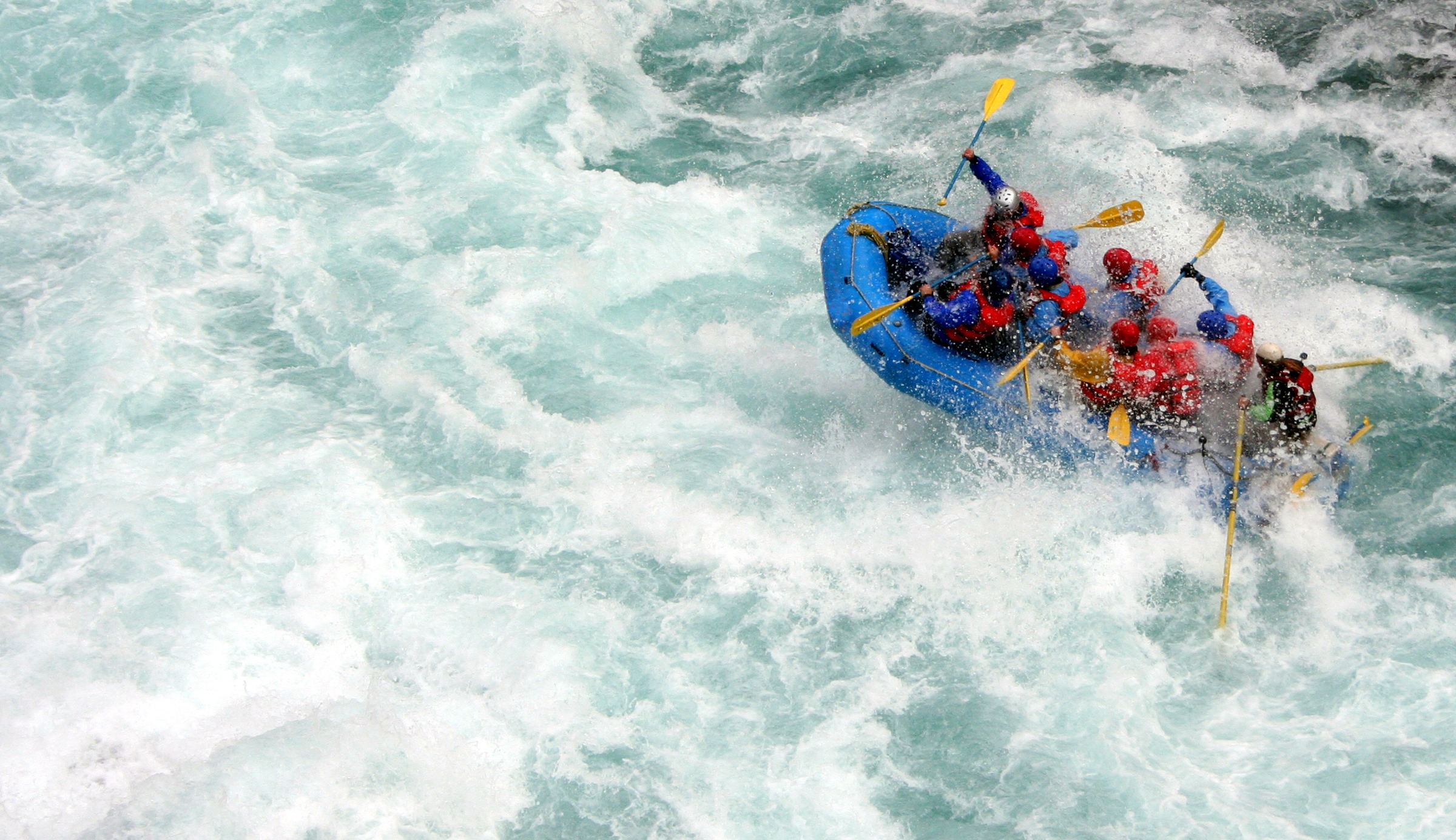 people-in-a-blue-inflatable-boat-river-rafting